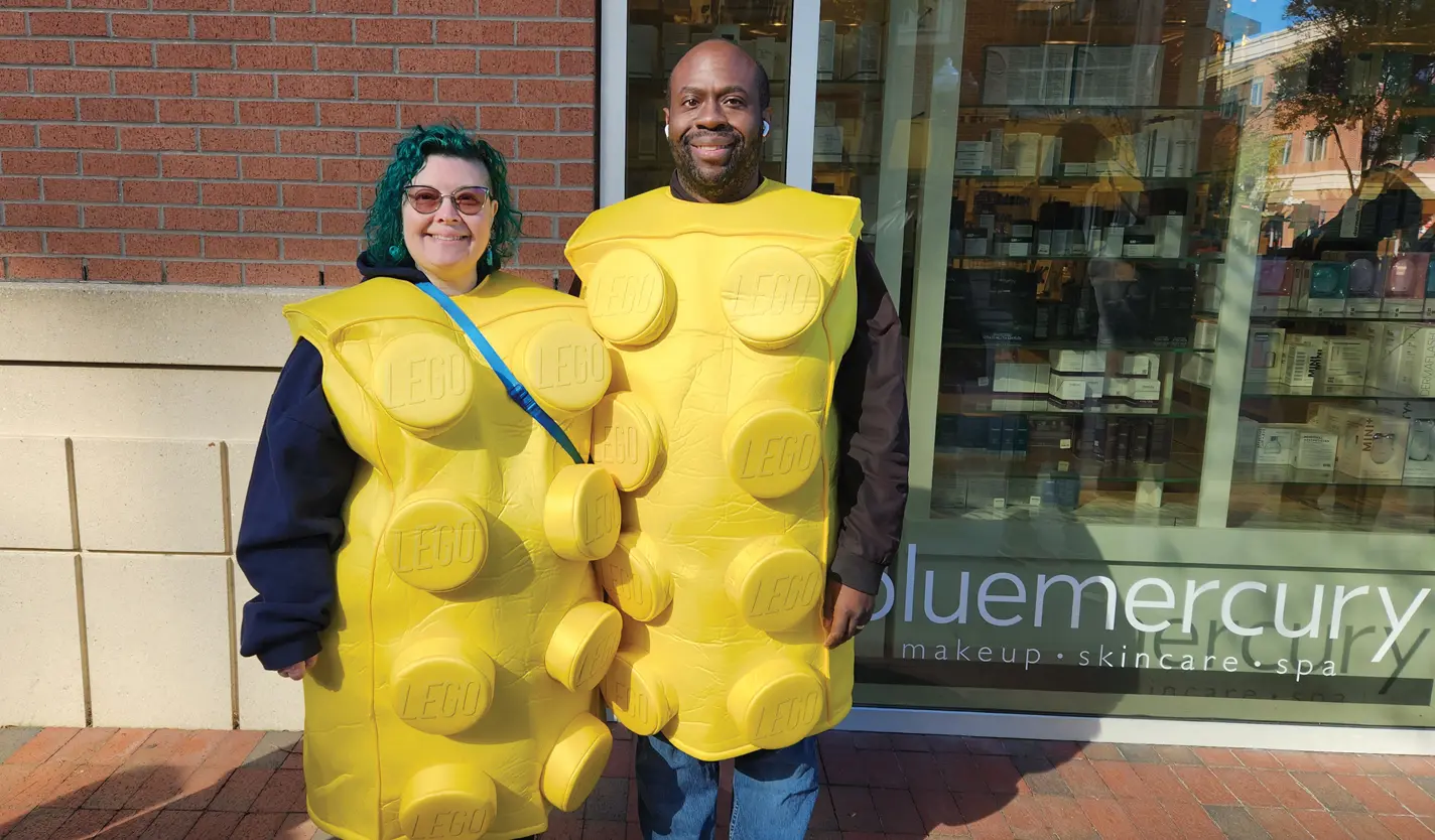 Lego fans Nicole and Brian Whitaker show their excitement on the opening day of the new storefront.
