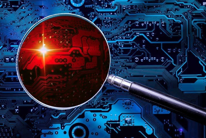 Blue circuit board background of computer motherboard and magnifier glass with red zoomed virus zone. Investigation for cyber