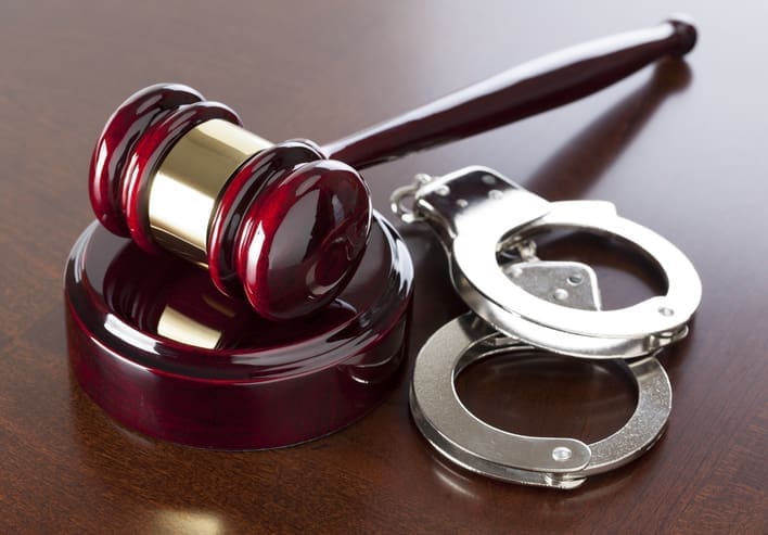 Gavel & Handcuffs on wood table. CLICK TO SEE MORE!