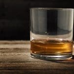 one single glass of straight bourbon also known as neat