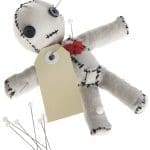 Cute handmade voodoo doll (Made completely by me) with a blank tag, being stabbed by pins