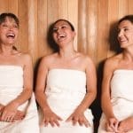 Women in sauna laughing