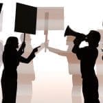 Silhouettes of people at political protest