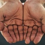 Cropped shot of a businessman standing with his hands opened