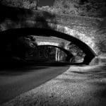 Infrared photograph of two bridges over a cobblestone parkway